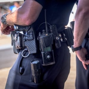 Two officers close up of belts