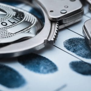 Image of police handcuffs and set of fingerprints | 2019 Police Training | Lathrup Village Police Officers | Paw Paw Police Officer career opening | City of Gibraltar Police Officer