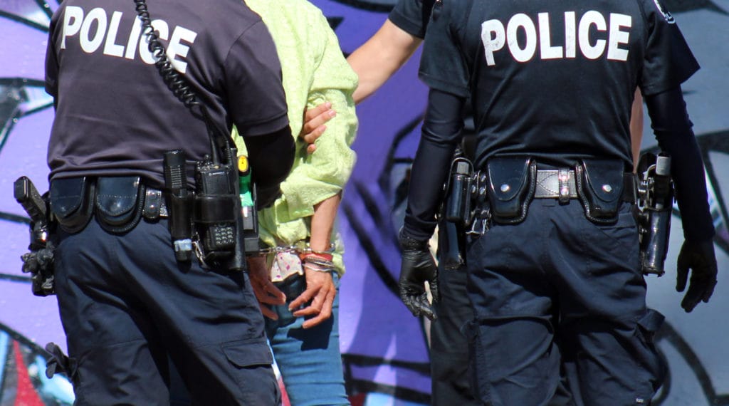 Up close arrest of homeless woman