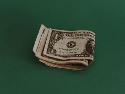 Image of one dollar bills | Retirement Income | Saving Early | Health Savings Account