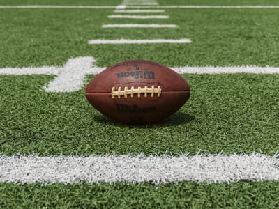 A football on a football field | Protecting our Officers