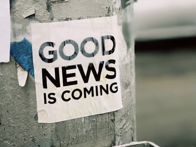 Good News is Coming sign on pole | 2020 Year In Review