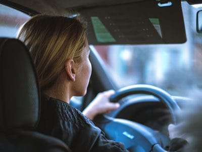 Teen sitting behind the steering wheel in a car | Traffic Stop Guidelines