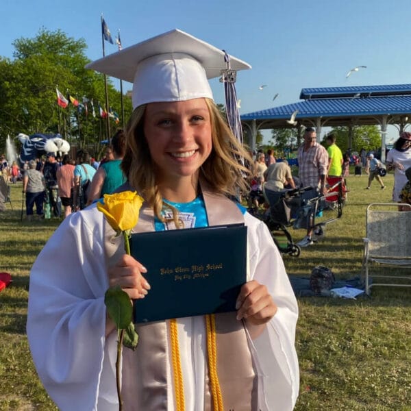 POAM Scholarship recipient Kami Box pictured at her high school graduation with her diploma.