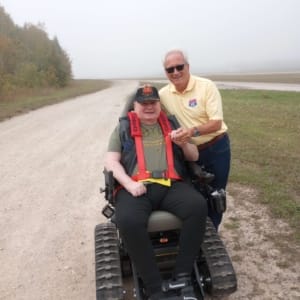 POAM &amp; Defender Mobility&#039;s Jim Tignanelli and veteran Chris Giles who received a TracFab chair donation.