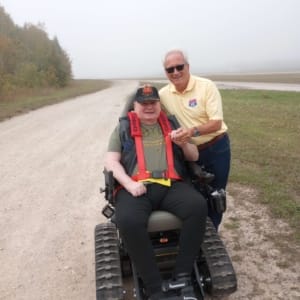 POAM & Defender Mobility's Jim Tignanelli and veteran Chris Giles who received a TracFab chair donation.