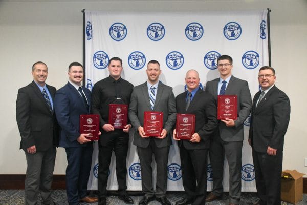 Bay City Officers Honored | Bay City Police Officers and Command Officers Associations' Officers Jacob Kirsch, Stephen Staron, Scott Selle, Brandt Cygan, and Sergeant Matthew Strunk receiving the 2025 Police Officer of the Year Award at the POAM Annual Convention.
