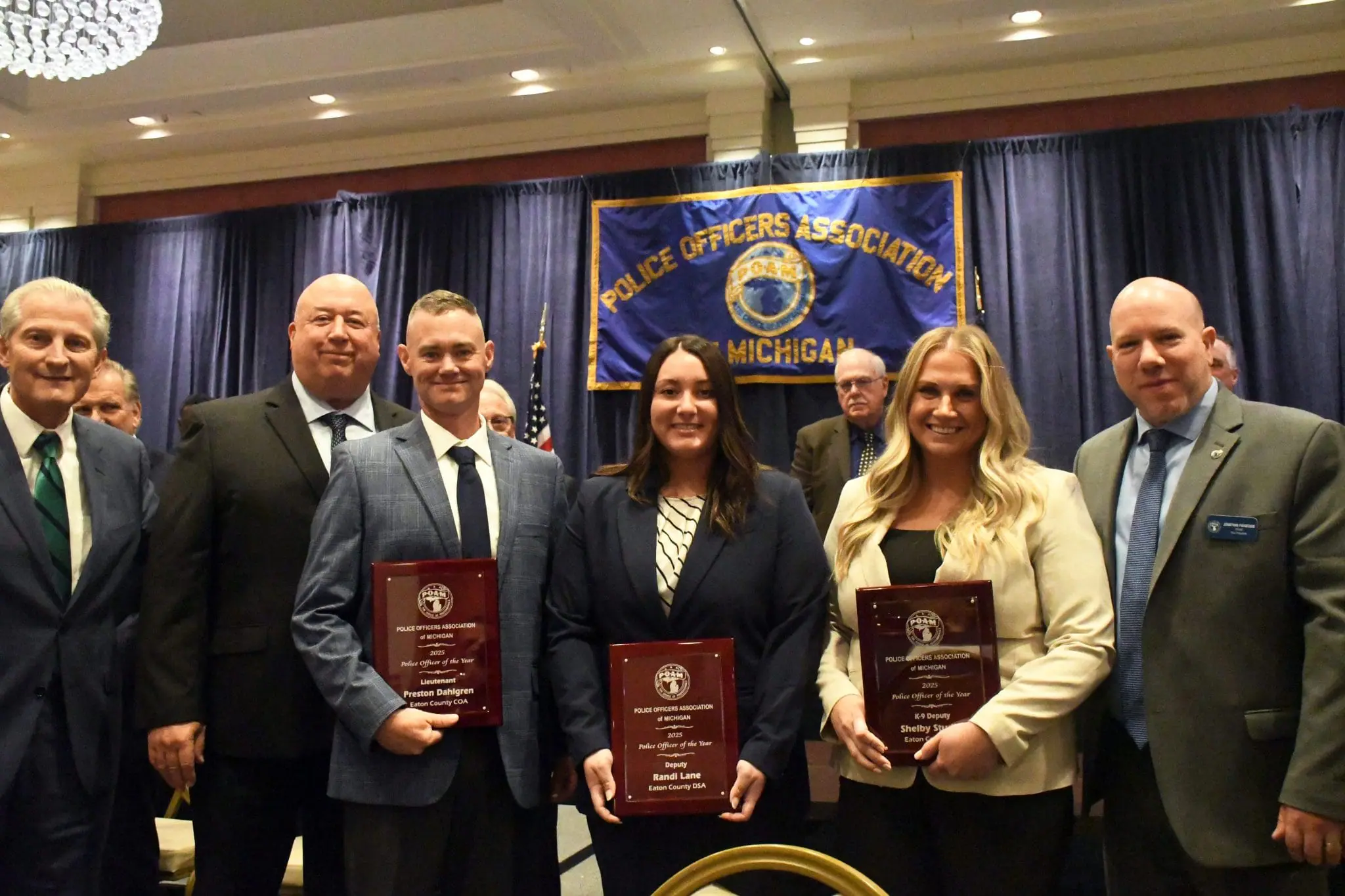 Eaton County DSA & COA Deputy Randi Lane, K-9 Deputy Shelby Studley, and Lieutenant Preston Dahlgren receiving their Police Officer of the Year Award at the Annual Convention.