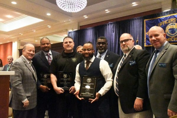 Wayne County Deputy Sheriff's Association Corporal John Pietz, Deputy LaQuawn Milhouse, and Deputy Robert Smith, III receiving the 2025 Distinguished Service Award at the POAM Annual Convention.