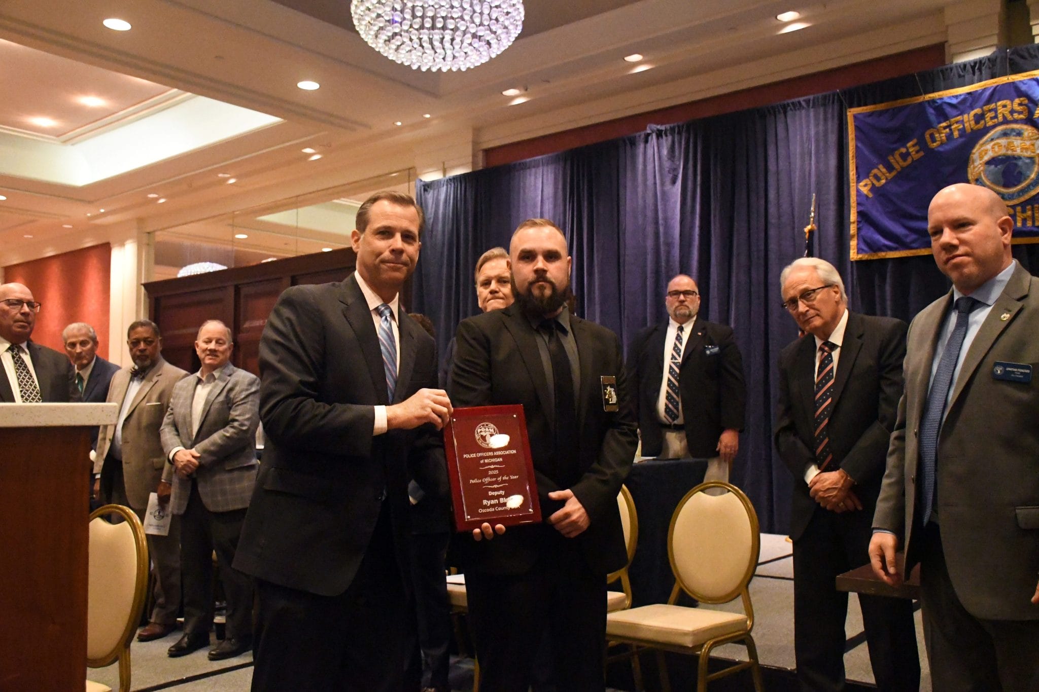 Oscoda County Deputy Ryan Blair receiving the 2025 POAM Police Officer of the Year Award. 