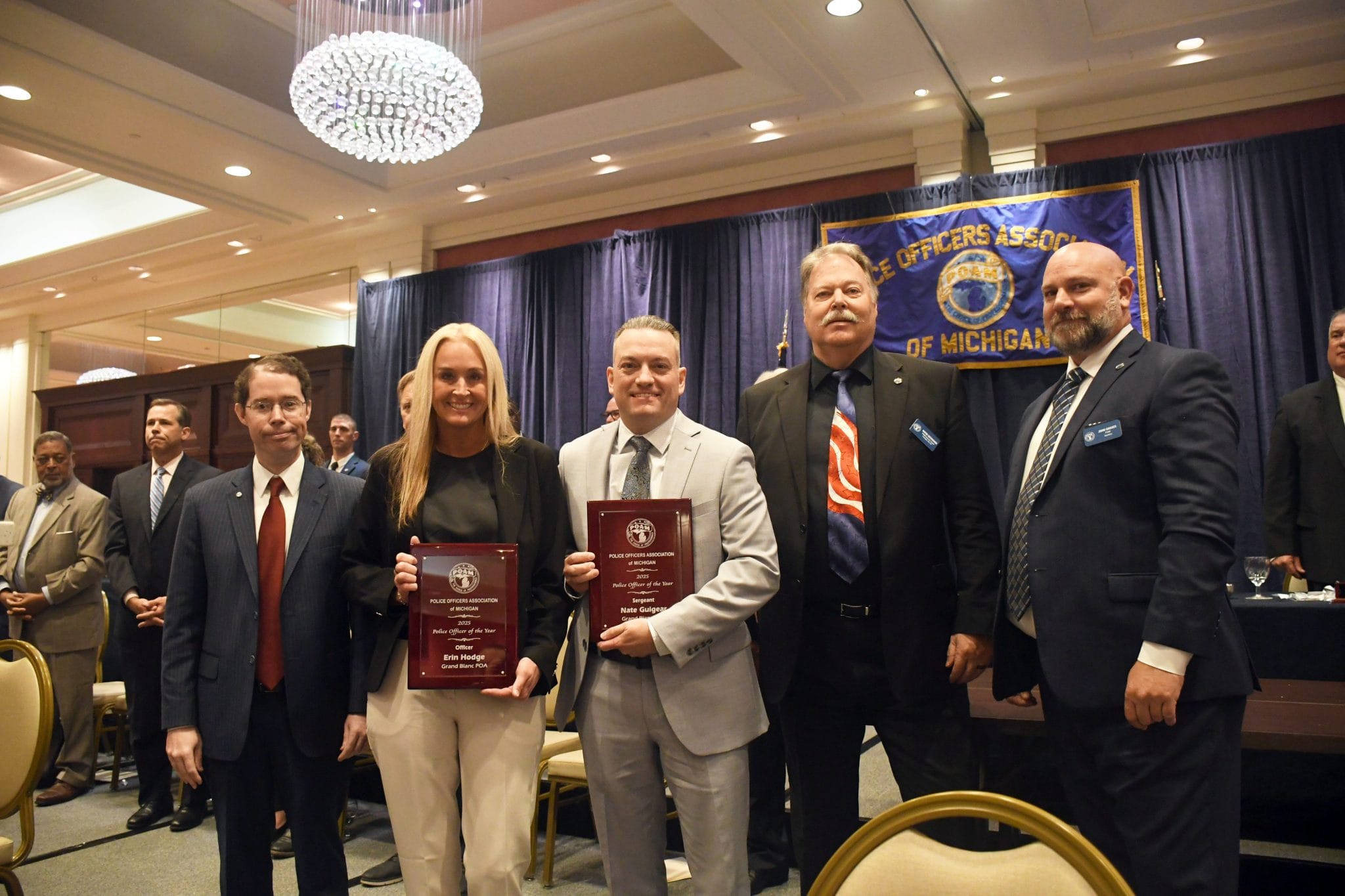 Grand Blanc COA & POA Sergeant Nate Guigear and Officer Erin Hodge receiving the 2025 POAM Police Officer of the Year Award with Judge Mertz and POAM team.