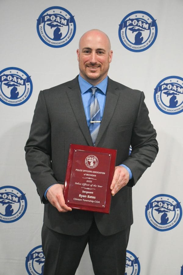 Clinton Township Police Officer Ryan Bates receiving the 2025 Police Officer of the Year Award at the POAM Annual Convention.