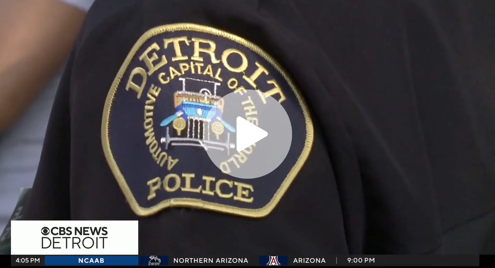 Detroit Police officer badge on shoulder of officer