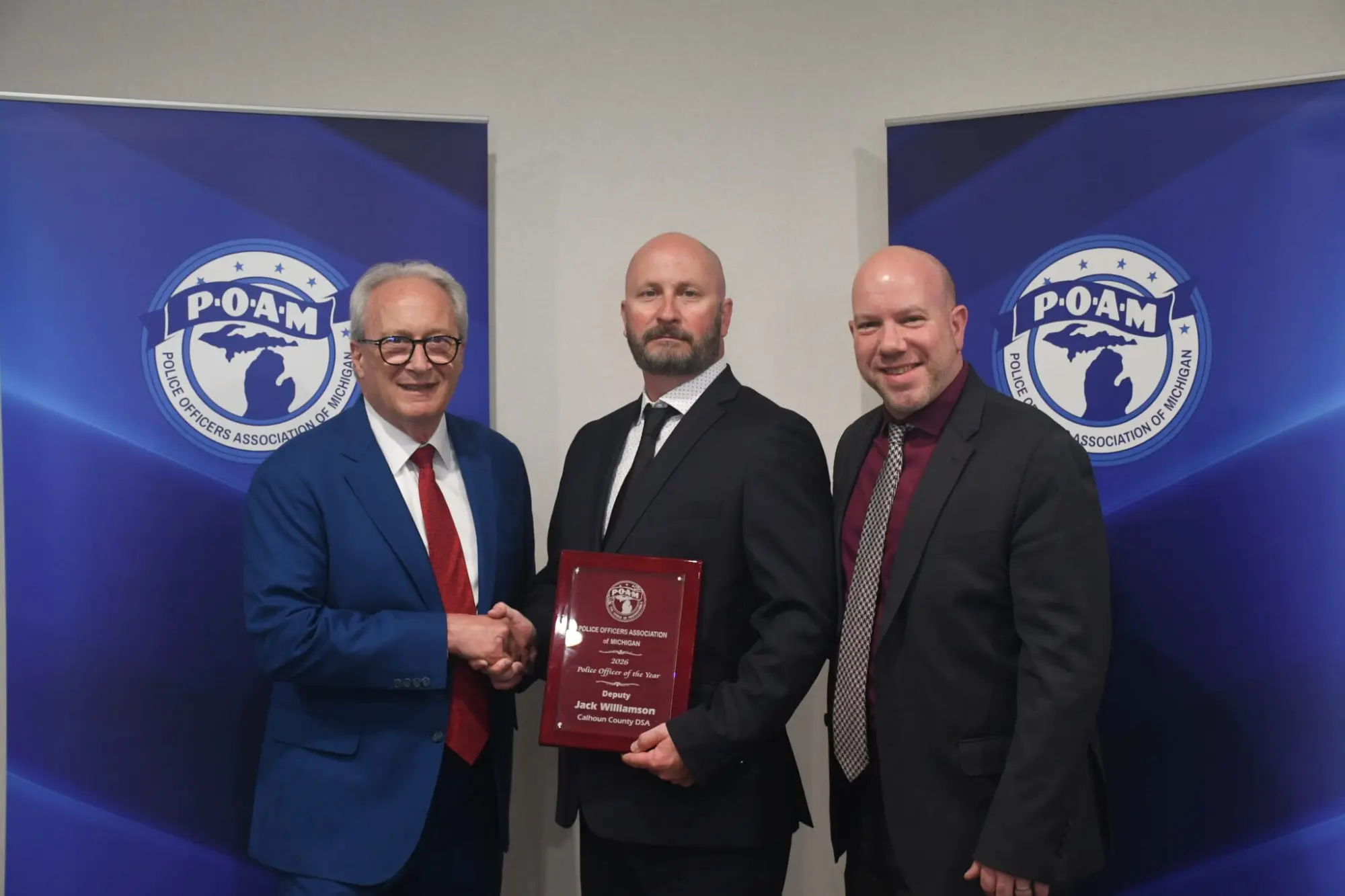 POAM President Jim Tignanelli, Deputy Jack Williamson, and Calhoun County DSA President Jonathan Pignataro