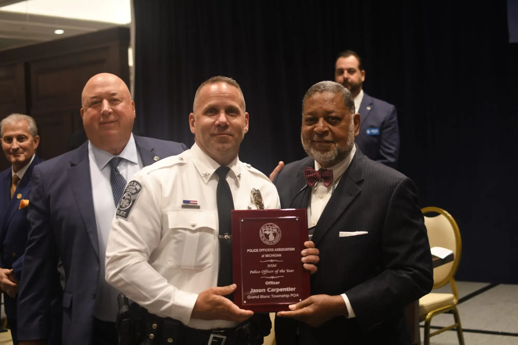 POAM Business Agent Gregg Allgeier, Grand Blanc Township Chief, and Justice Robert P. Young, Jr